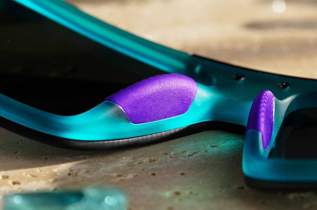 Close up of purple nose padding on the Heat Wave Performance Quatro sunglasses with purple lenses and aqua frame
