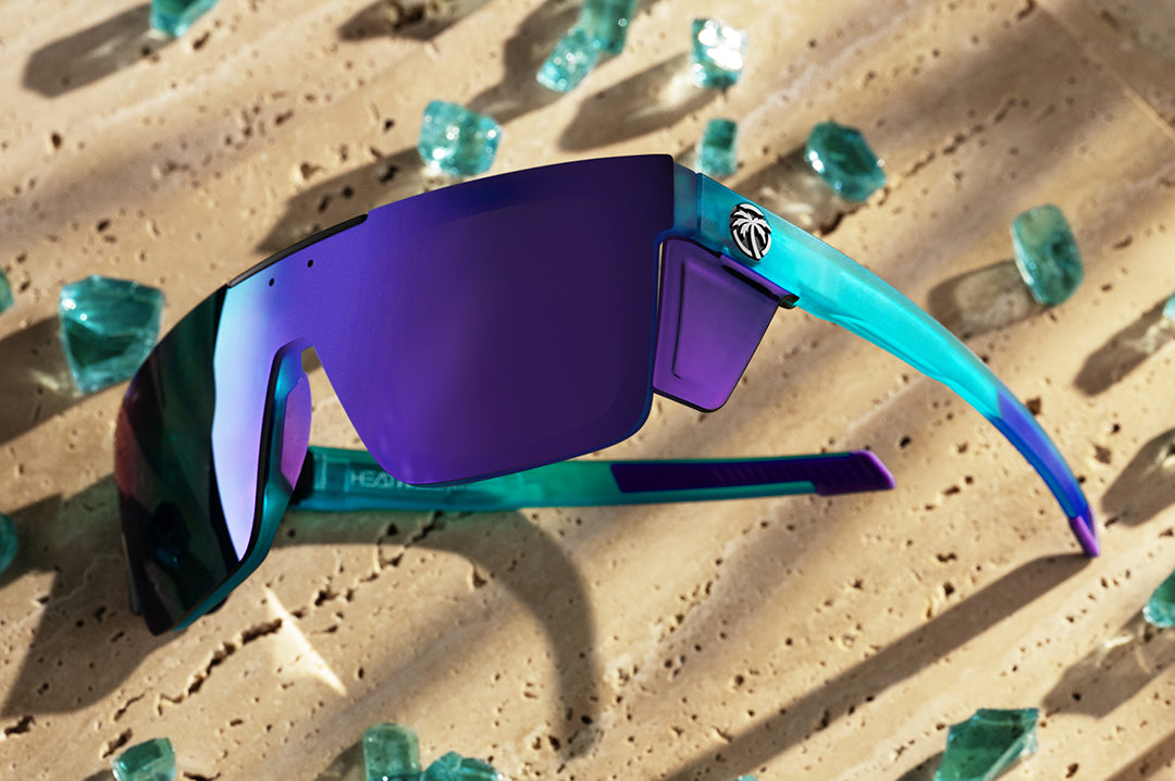 Heat Wave Performance Quatro sunglasses with purple lenses and aqua frame pictured with broken glass