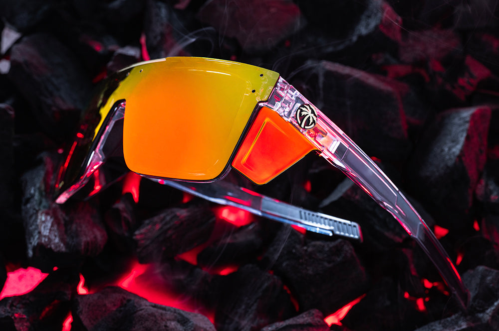 Side View of Heat Wave Quatro Vapor Clear Sunblast safety sunglasses with hot bbq coals behind them.