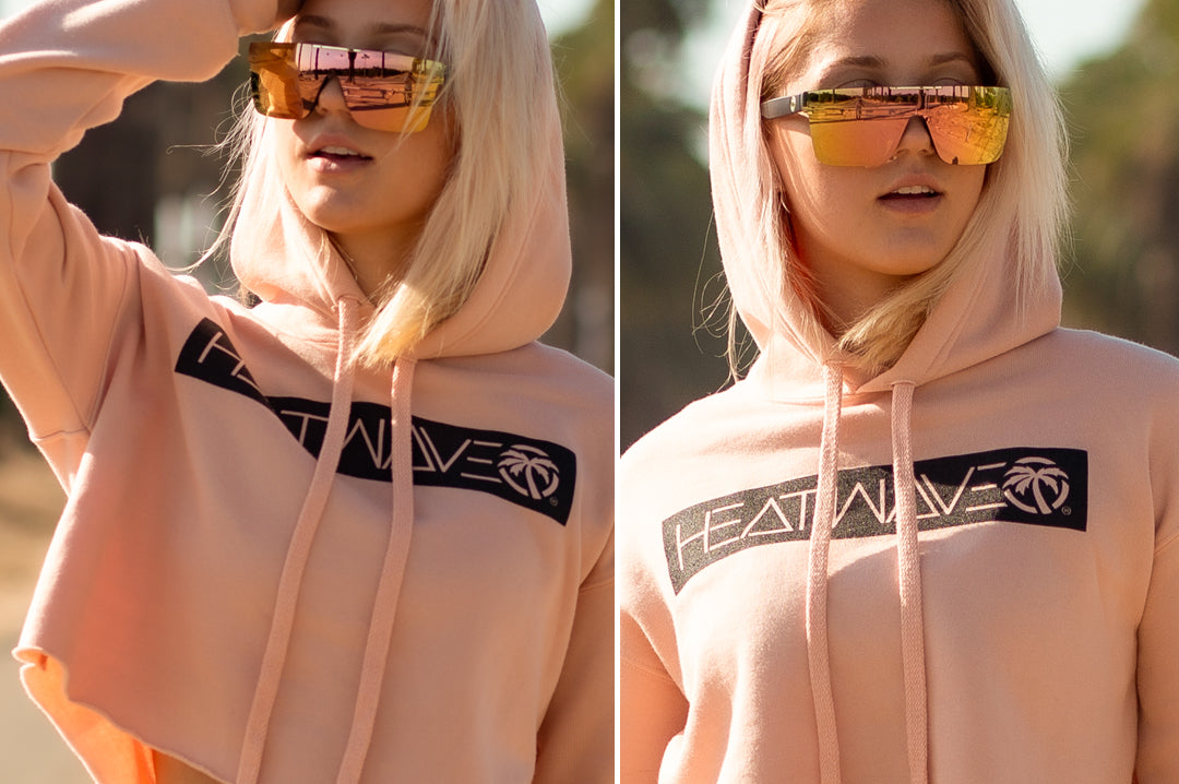 Women out on a walk wearing Heat Wave Visual Quatro Sunglasses with black frame and rose gold lens.