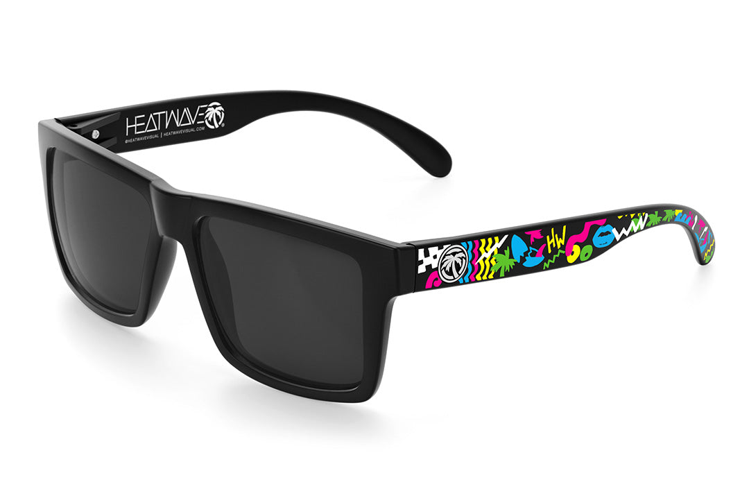Heat Wave Visual Vise Sunglasses with black frame, beach party print arms and black lenses.